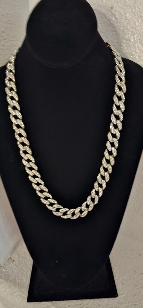 Cuban chain necklace silver tone one side many crystals other side plain.