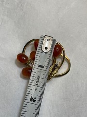 Vintage gold tone brooch with amber colored stones