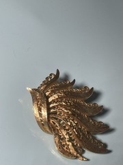 Vintage Monet Gold Tone Textured Peacock Filigree Brooch