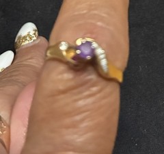 Vintage Style ring features a gold band with a prominent purple stone 14 ct Gold