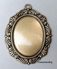 #1793 ANTIQUED GOLD 40×30 FILIGREE BORDERED BEZEL W/TOP HANG RING – 1 Pc