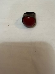 vintage silver dome-style cocktail ring featuring a prominent, smooth red caboch