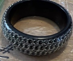 BLACK ACRYLIC LUCITE BANGLE WITH ENCASED SILVERTONE CHAINS