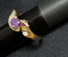 Vintage Style ring features a gold band with a prominent purple stone 14 ct Gold