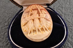 Vintage oval shell cameo, “Dancing Goddesses” (38.5ct) sign by artist with case.