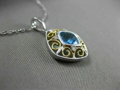 ESTATE 1.14CT DIAMOND & BLUE TOPAZ 14KT 2 TONE GOLD OPEN SQUARE FLOATING PENDANT