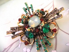 large brooch gold tone with faux opal + red, green &clear zircons