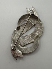 VINTAGE SILVER TONE BOW IN DOLLAR SIGN LIKE SHAPE BROOCH