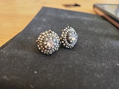 Vintage style costume jewelry earrings featuring a circular halo cluster design