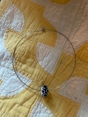 SS NECK WIRE WITH BLACK & WHITE GLASS BEAD, FROM PARIS – NEW, NEVER WORN