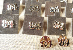 Vintage NOS lot of 15 gold tone 1984 tac lapel pins 1/2″ D79