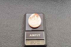 Vintage shape shell cameo, “Woman Sitting on a Terrace” (52.5ct), sign by artist