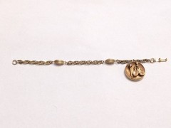 Vintage Mid-Century Gold Tone Lady on Bicycle Charm Bracelet