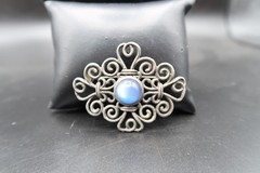 Vtg Silver Tone Scroll Work W/ Blue Irredescent Center Cabochon Bead Brooch 2.5″