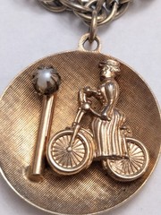 Vintage Mid-Century Gold Tone Lady on Bicycle Charm Bracelet