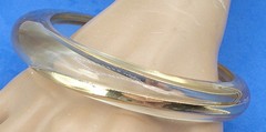 VINTAGE BCBG MAXAZRIA ASYMMETRICAL BANGLE BRACELET CLEAR GOLD TONE BANDS INSIDE