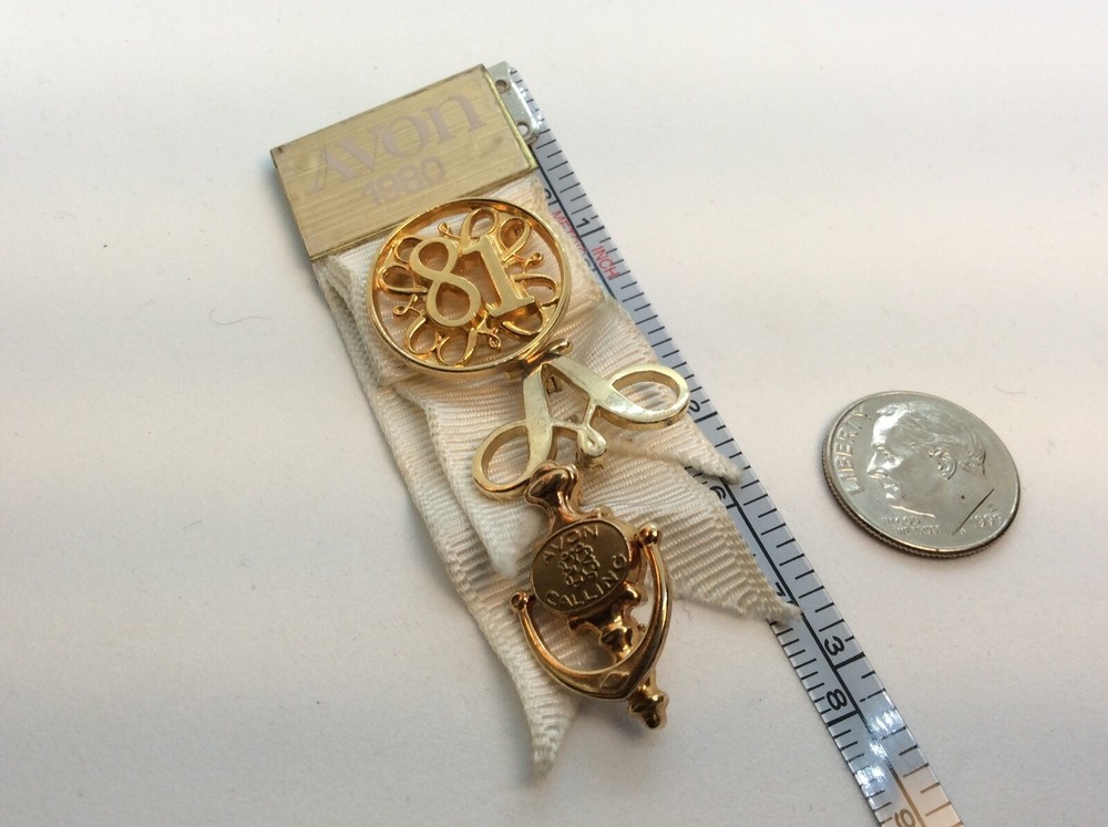 Vintage Avon seller’s award pins from the 1981
