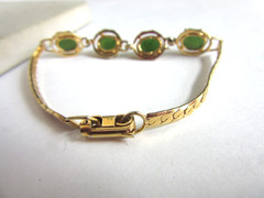 Vintage gold tone herringbone chain with 4 faux jade cab stones bracelet