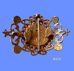 Vintage Filigree Brooch with a rich dark gray domed mirror-finished center stone