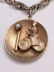 Vintage Mid-Century Gold Tone Lady on Bicycle Charm Bracelet