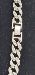 Cuban chain necklace silver tone one side many crystals other side plain.