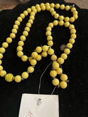 Very Vintage Yellow Beaded Stamped Moon C Necklace.
