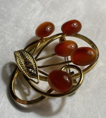 Vintage gold tone brooch with amber colored stones