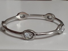 Fauceted crystal accent bangle bracelet Silvertone bezel set stones