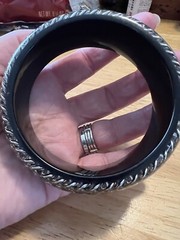 BLACK ACRYLIC LUCITE BANGLE WITH ENCASED SILVERTONE CHAINS