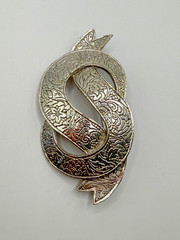 VINTAGE SILVER TONE BOW IN DOLLAR SIGN LIKE SHAPE BROOCH