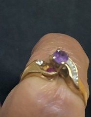 Vintage Style ring features a gold band with a prominent purple stone 14 ct Gold