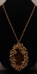 NAPIER Large Gold Tone Brutalist with Golden Brown Center Pendant Necklace