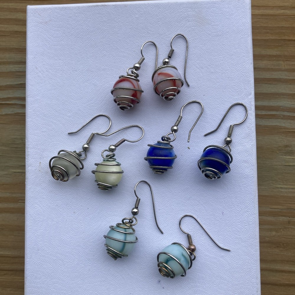 4 pr. vintage wire wrapped cased glass marble dangle, / pierced earrings